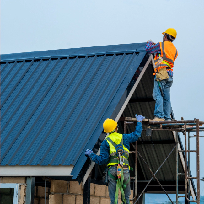 contractors installing metal roof